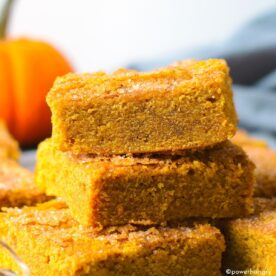 vegan pumpkin protein bars stacked in top of each other