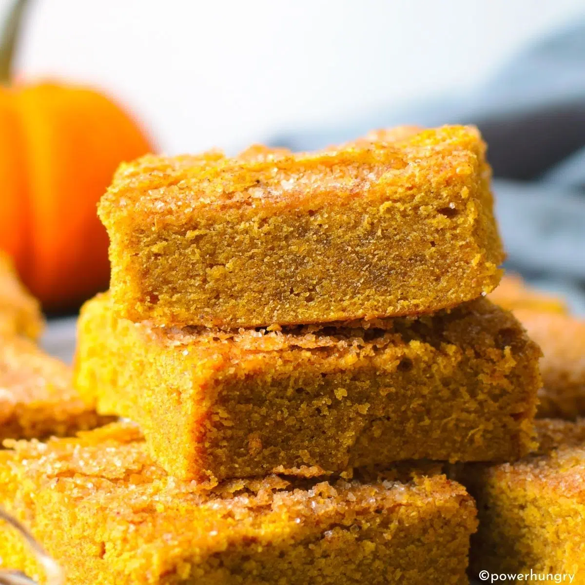vegan pumpkin protein bars stacked in top of each other