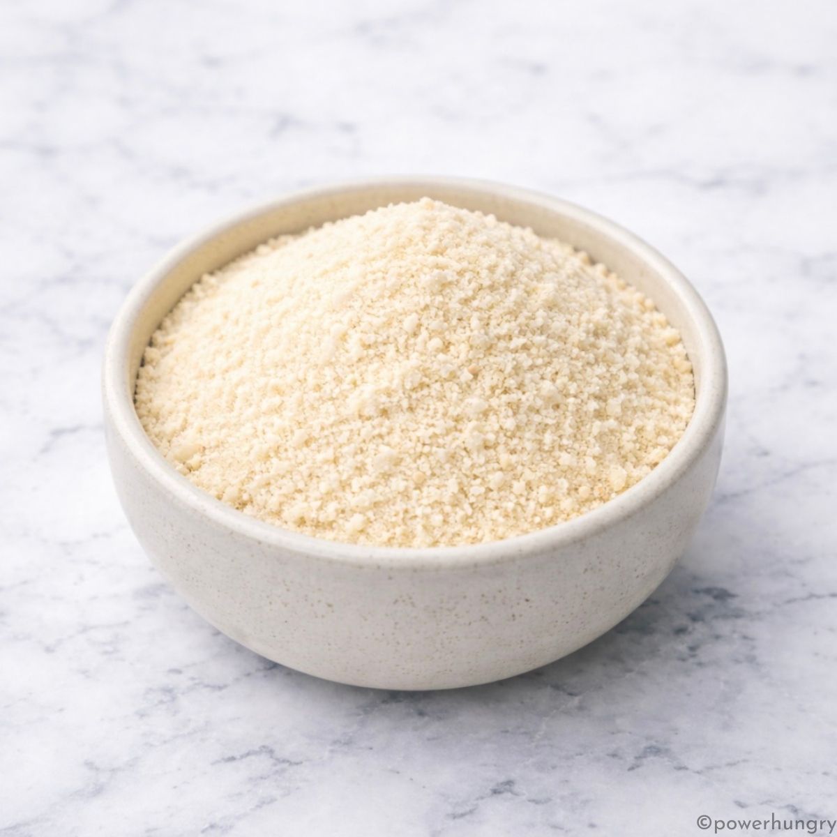 almond flour in a white stoneware bowl
