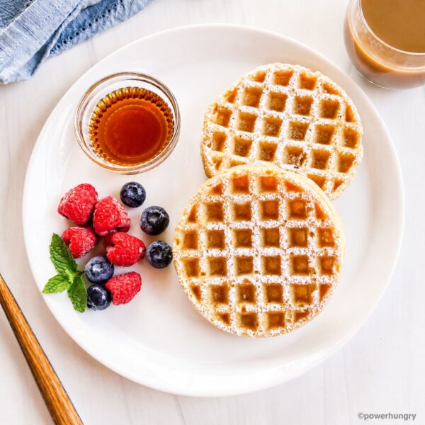 red lentil waffles on a plate with berries