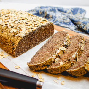 easy high protein oat bread on a cutting board, sliced