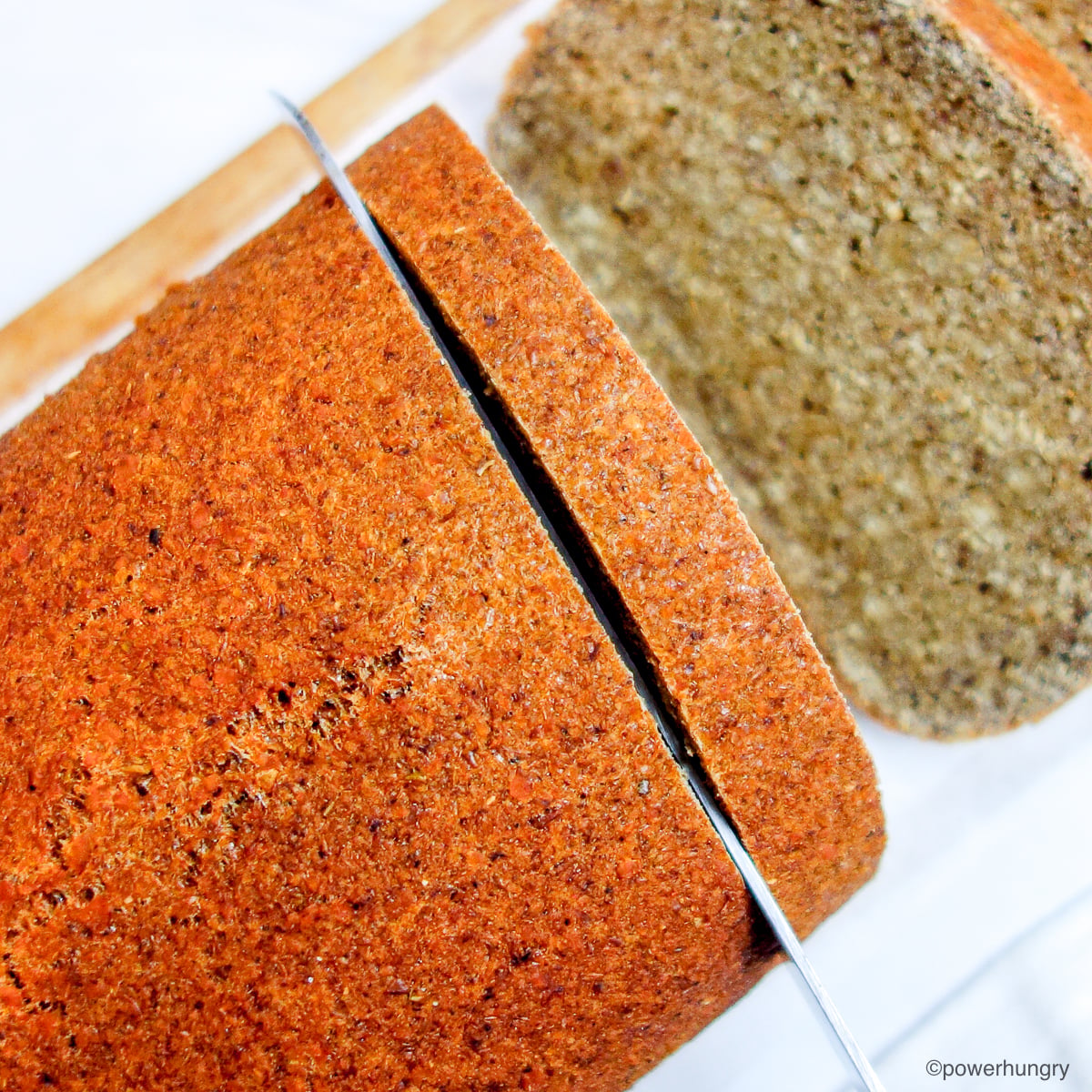 sliced lentil pumpkin bread on a cutting board