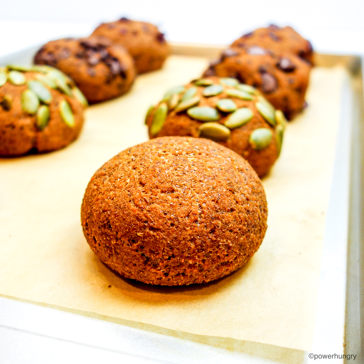 close up of pumpkin lentil rolls on a baking sheet
