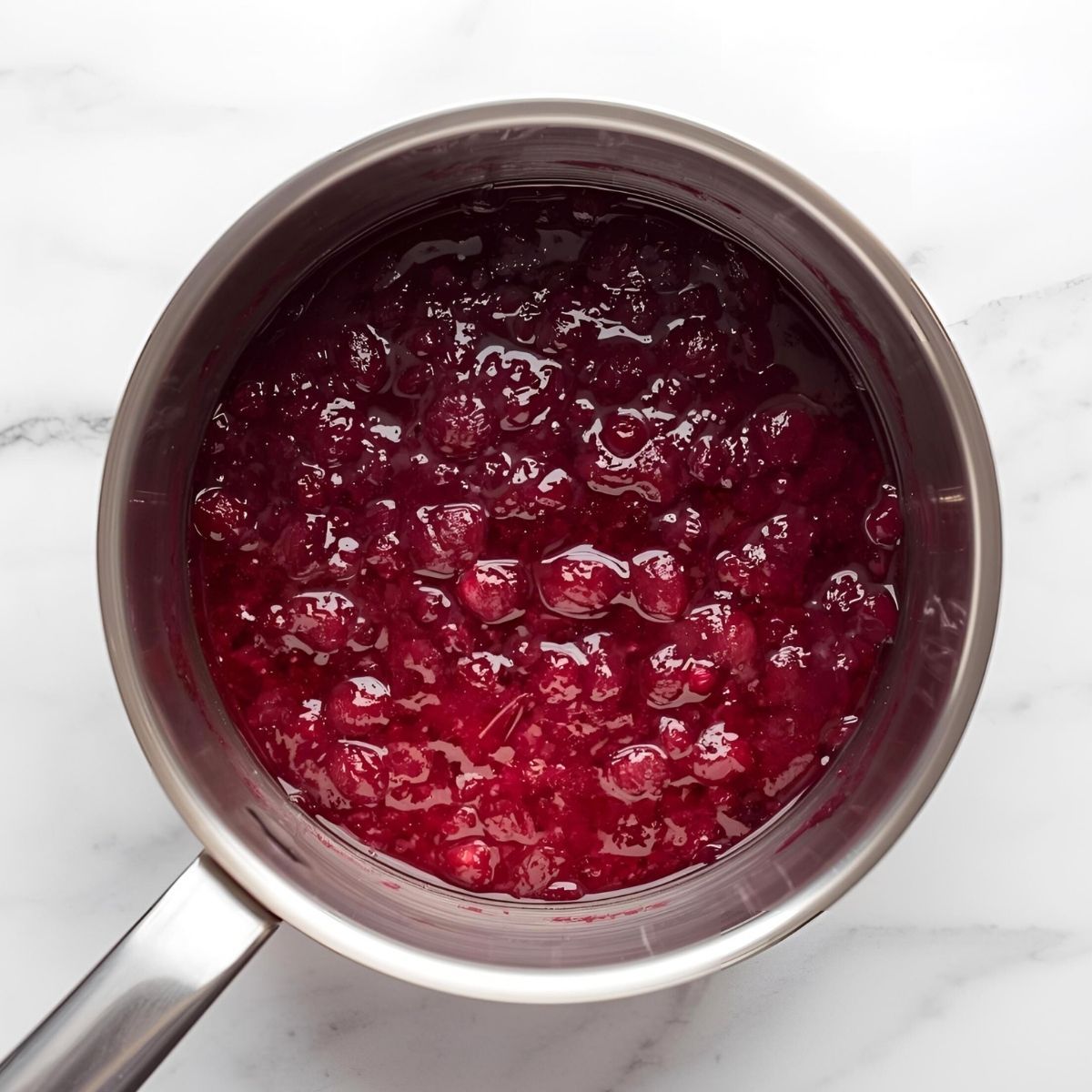 cranberry sauce in a stainless steel saucepan