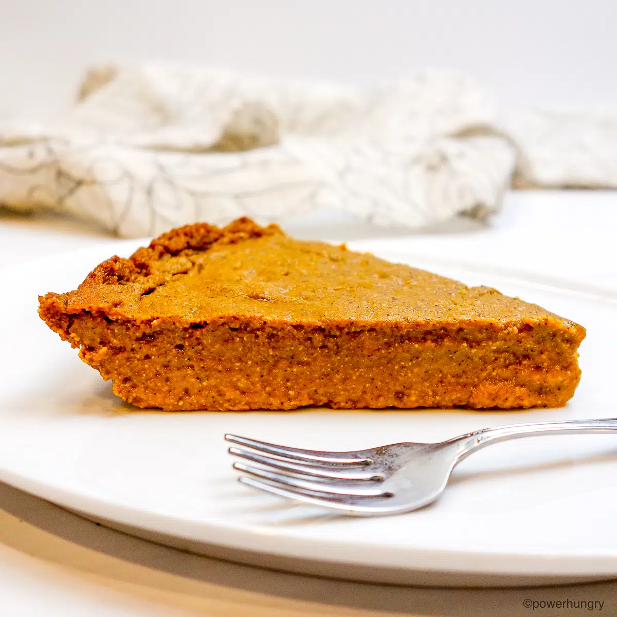 slice of no crust pumpkin pie on a white plate