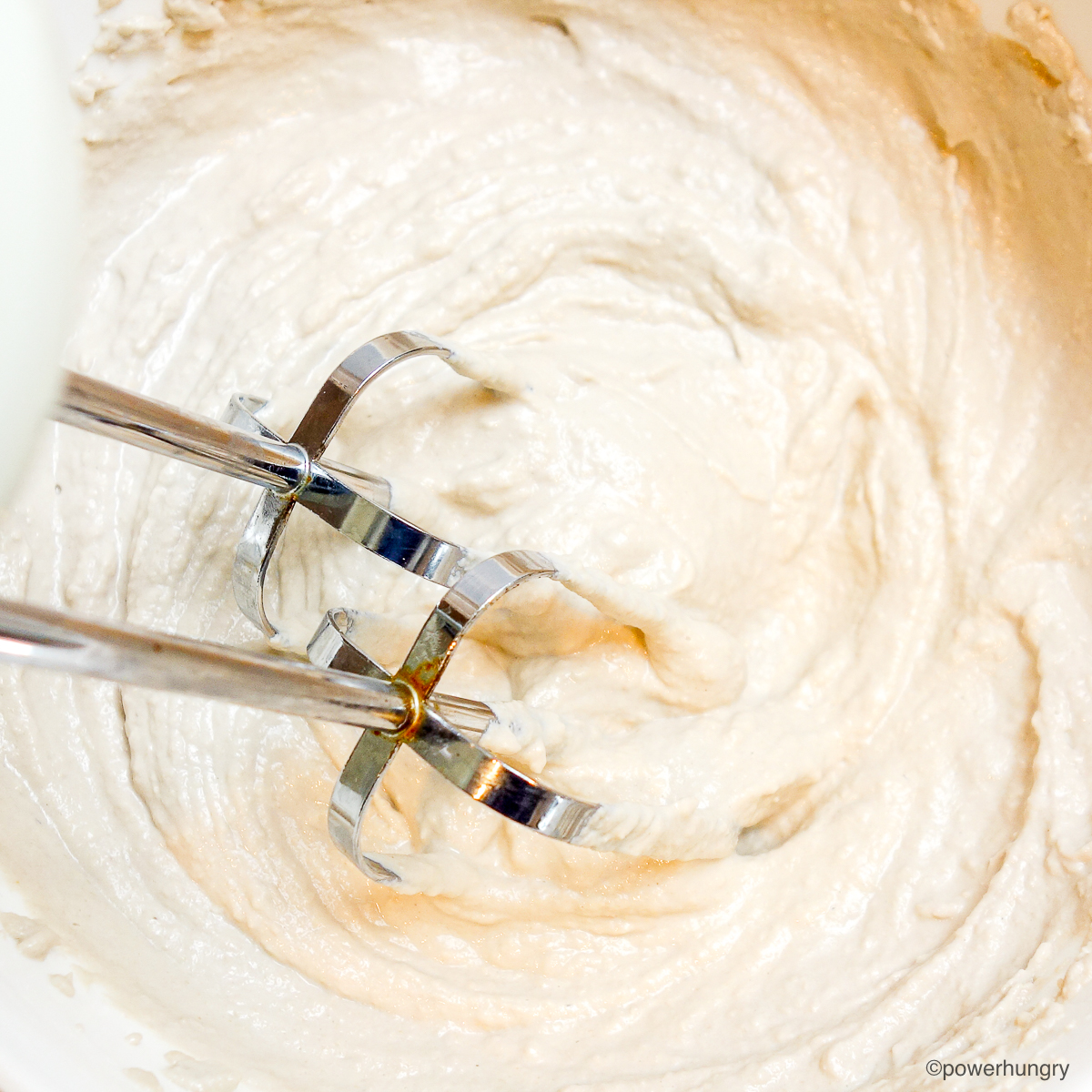 sunflower seed whipping cream getting beaten with electric beaters