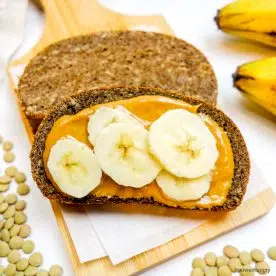 high protein banana bread topped with peanut butter and banana slices
