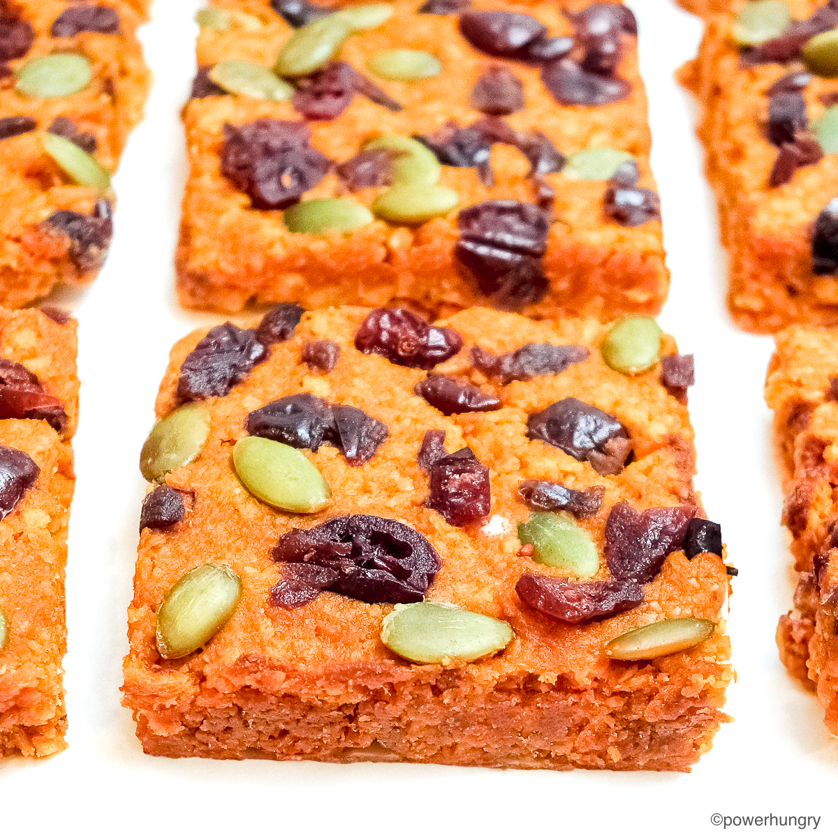 close up of tvp pumpkinprotein bars on a piece of white parchment paper