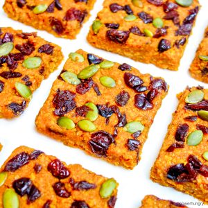 tvp pumpkin protein bars on a white piece of parchment paper