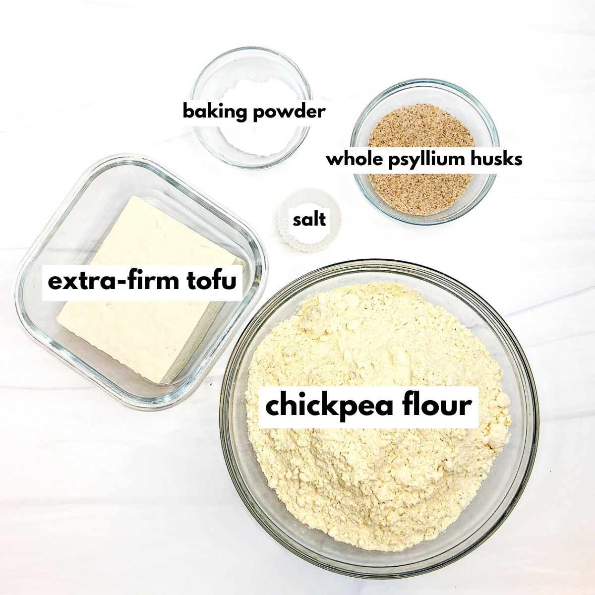 ingredients for chickpea flour protein bread, all in glass bowls