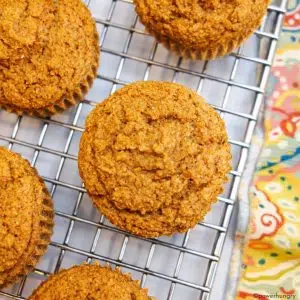 overhead shot applesauce oat flour muffins on cooling rack