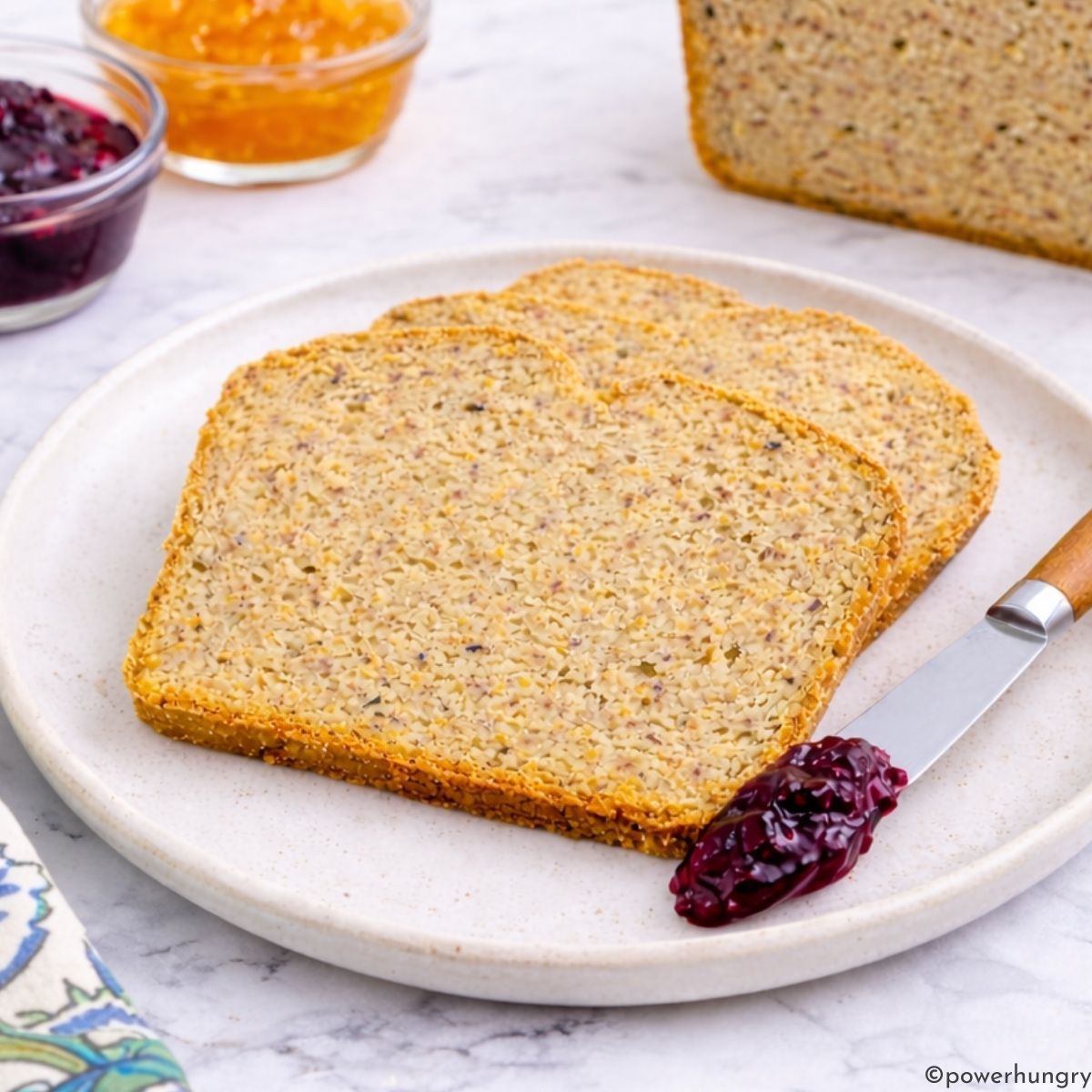 slices of high protein millet bread on a white plate