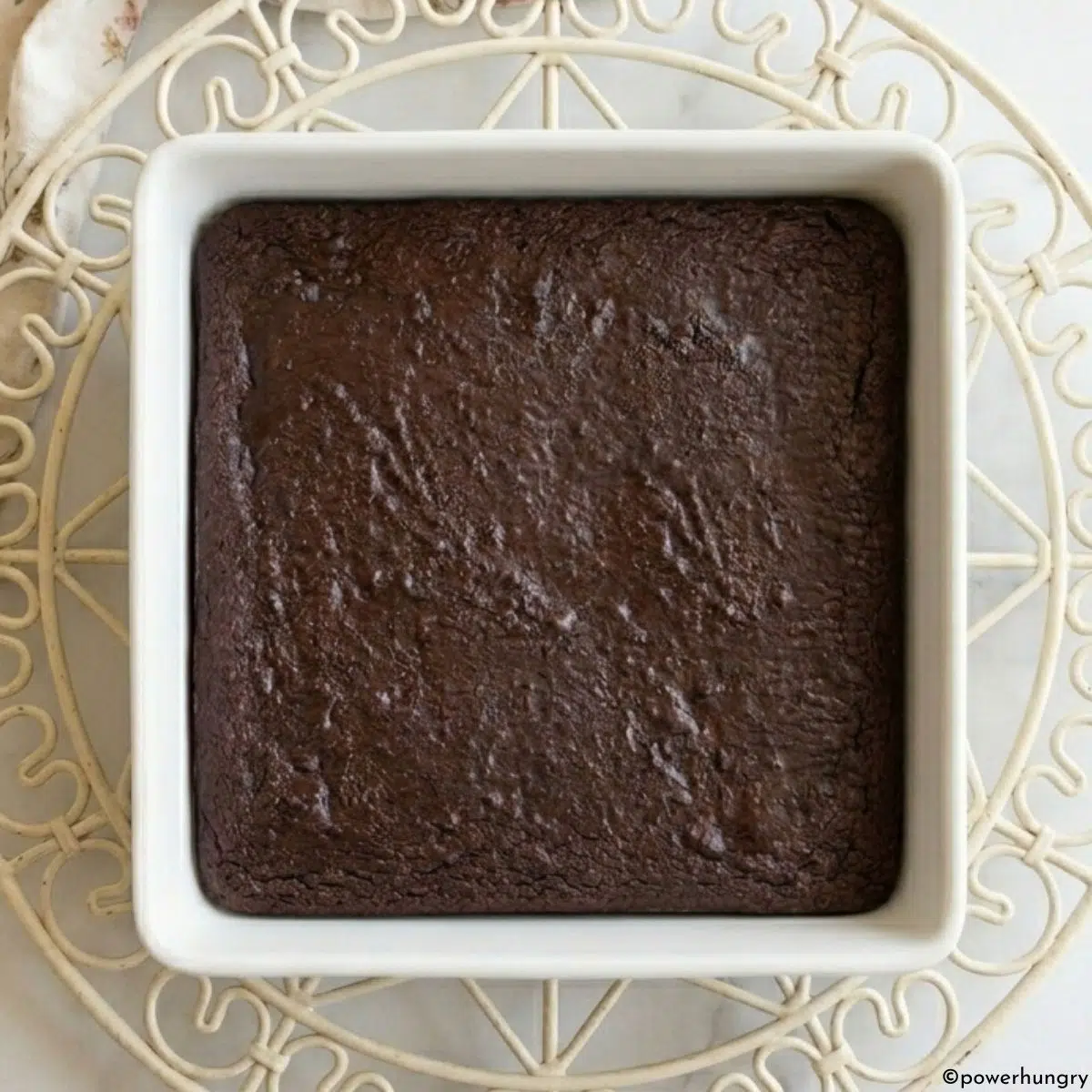 vegan carob almond flour brownies cooling on an antique cooling rack